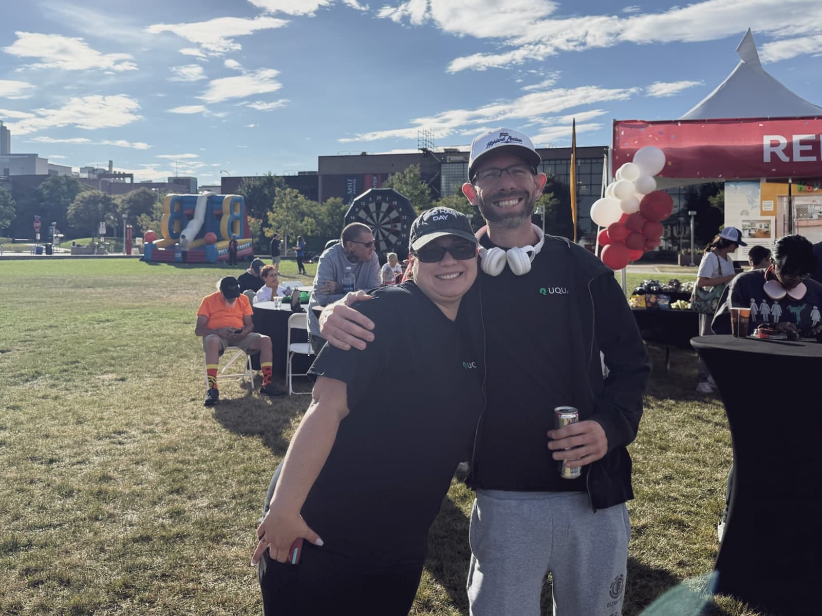 UQUAL team members at an outdoor community event